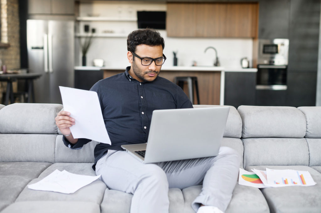 Person looking at their computer for social security disability forms. 