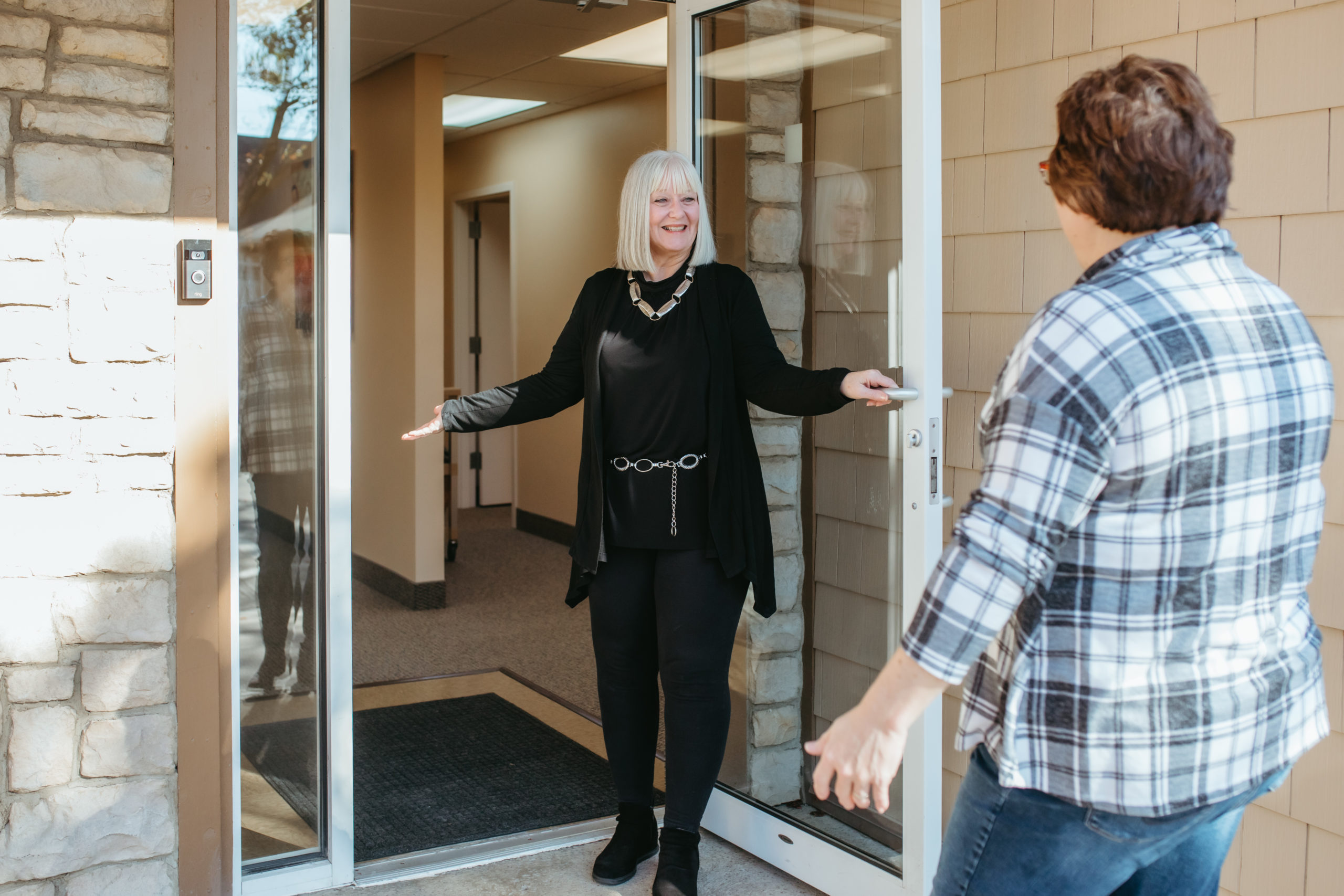 Roose & Ressler greeting a client